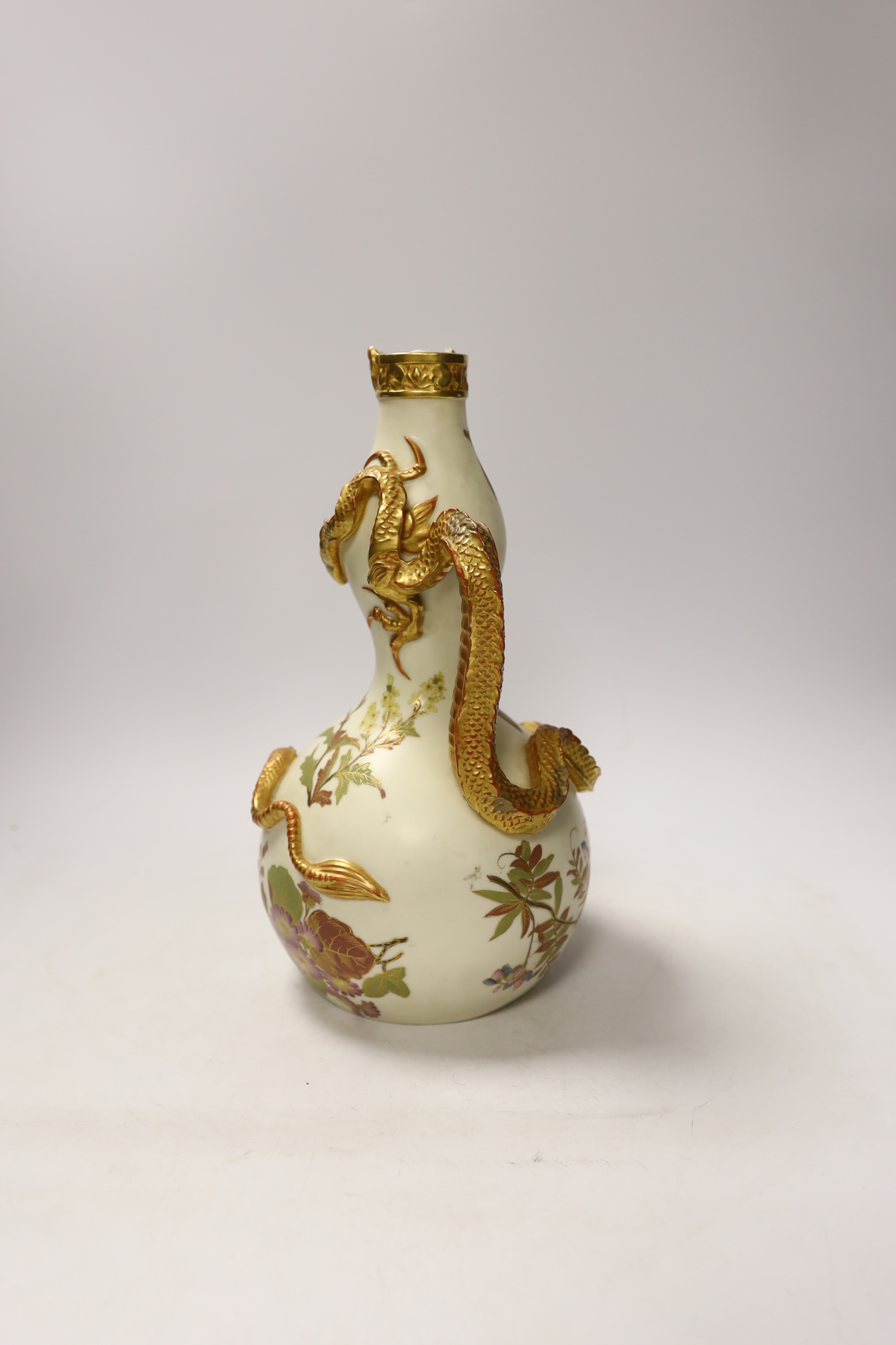 A Royal Worcester ewer with dragon handle, numbered 1035, 29cm high